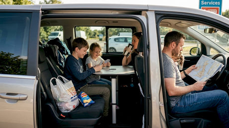 Family in minivan enjoying bonding during trip