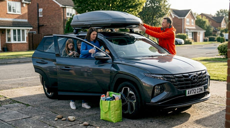 Family preparing SUV for a road trip